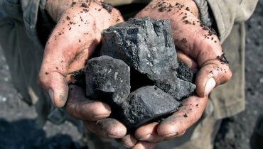 Coal in Miner's Hands